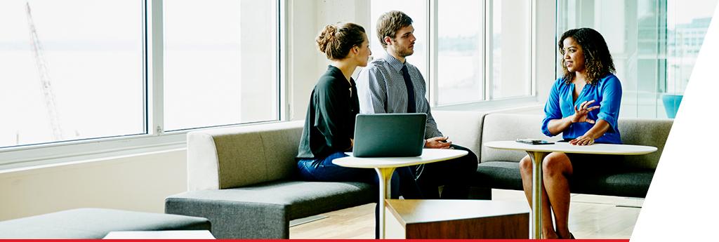 Three colleagues sitting in a meeting together