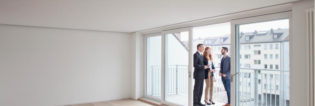 Real Estate Agent Showing Clients a Home