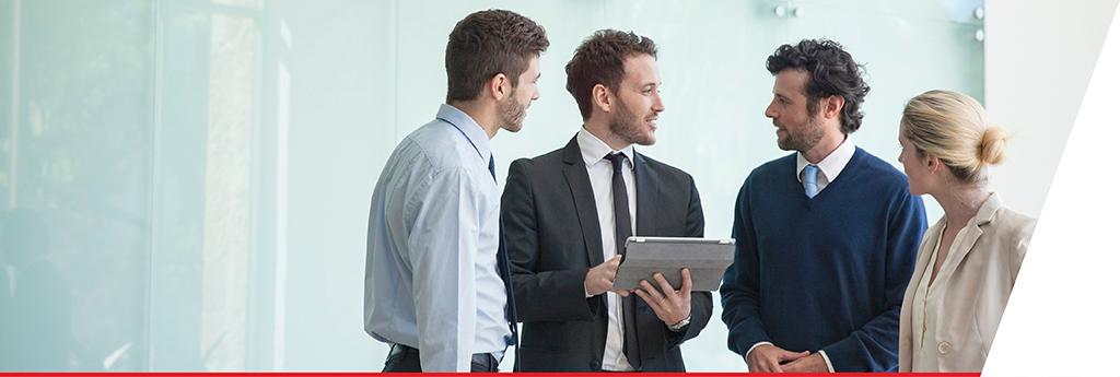 Colleagues talking in a conference room