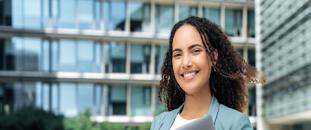 Woman standing in front of an office building