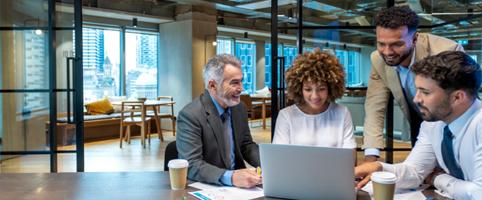 Team working at a desk in an office